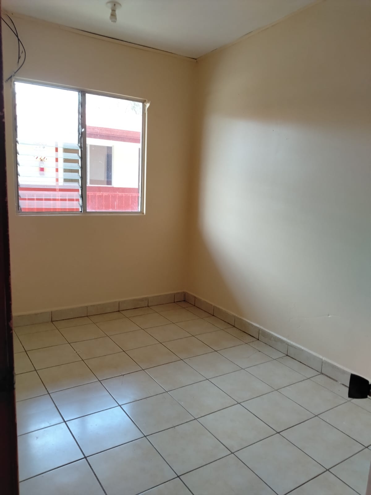 Cuarto de apartamento con cama en Apartamentos Damaro